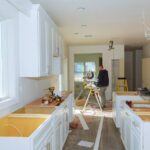 contractor-using-circular-saw-cutting-crown-moulding-renovation_73110-1675.jpg